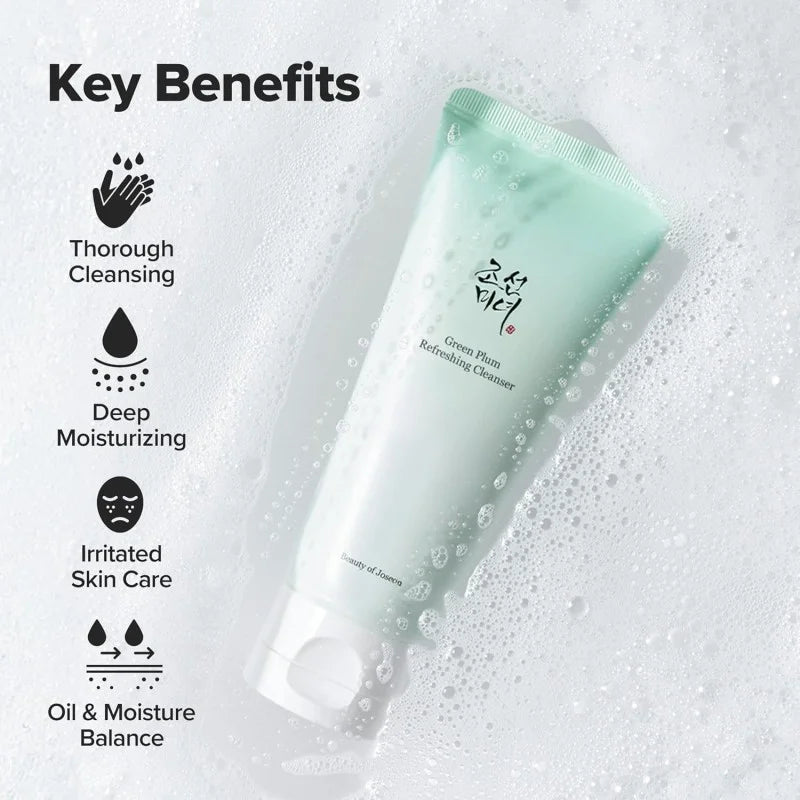 Green cleanser tube with key benefits listed on a textured background